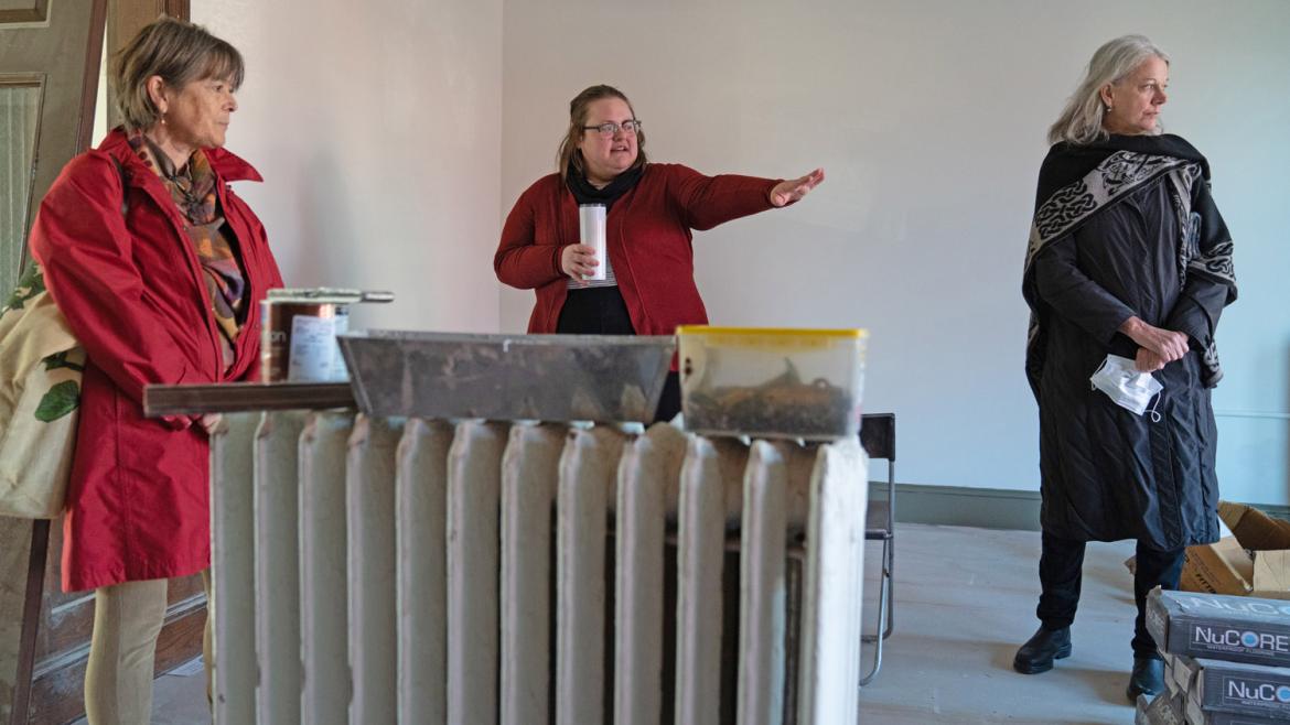 Sarah Johnson (center), director of Friends Place, tours the renovations with FCNL Assistant Clerk Mary Lou Hatcher (left) and General Secretary Diane Randall (right). 